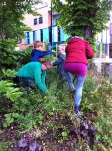 Group with children weeding